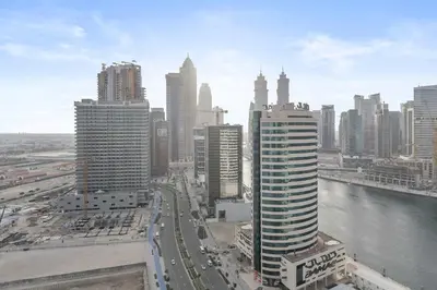 a view of a city with buildings and a river at Silkhaus luxurious 1BDR in AG Tower, Business Bay in Dubai