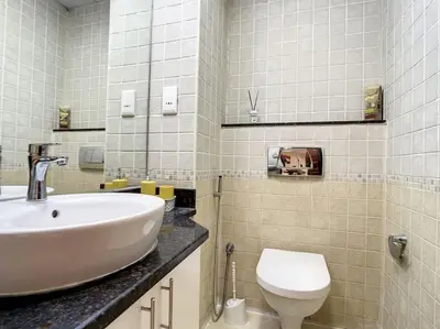 a bathroom with a sink and a toilet at Vacationer I Premium 3 Bedroom Apartment I Close to Marina Promenade & JBR Beach I Prime Location in Dubai