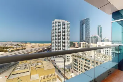 a view of the city from the balcony of a building at Vacationer I Premium 3 Bedroom Apartment I Close to Marina Promenade & JBR Beach I Prime Location in Dubai