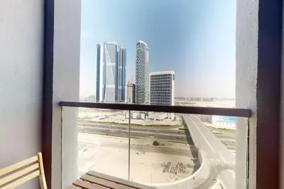 a view of a city from a window in a building at 15 Northside - Chic Studio in Dubai