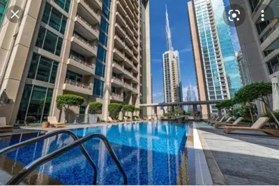 a swimming pool in a city with tall buildings at BellaVista - Spectacular - 2 BR Penthouse - Boulevard Central - Panoramic Terrace & Burj Khalifa View in Dubai