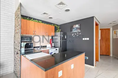 a kitchen with a black counter top in a room at Lake View All Bills Included Fully furnished in Dubai