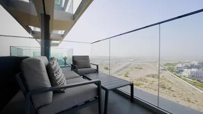 a room with a couch and a table and windows at Maison Privee - Graceful Apt in Prestigious Dubai Hills close to the Golf Course in Dubai