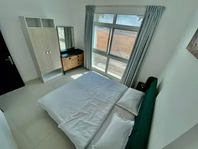 a bedroom with a bed and a window at Cute Rooms and Small Partitions for Girls in Dubai- Female guests only فتيات فقط in Dubai