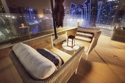 a room with a view of a city at night at The Suite Dubai 15 Northside Luxury Living in Dubai