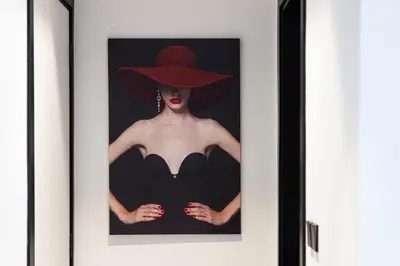 a picture of a woman wearing a red hat at The Suite Dubai 15 Northside Luxury Living in Dubai