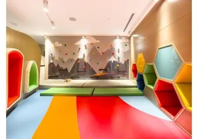 a room with a brightly colored room with a wall at Keyrock Living - Burj Khalifa View Retreat with Pool in Dubai