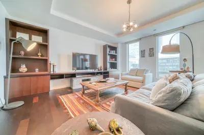 a living room with a couch and a table at Limestone House, Dubai International Financial Centre - Mint Stay in Dubai
