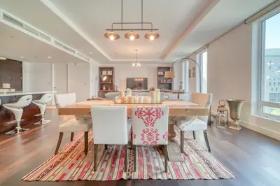 a dining room with a table and chairs at Limestone House, Dubai International Financial Centre - Mint Stay in Dubai