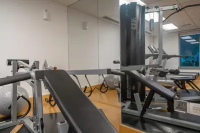 a room with a gym with a treadmill at Bellavista - High Floor - 1BR - 29 Boulevard - Burj Khalifa & Fountain View in Dubai
