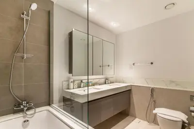 a bathroom with a shower and a sink and a toilet at Spacious 2 Bedroom on High Floor in Creek Horizon - Allsopp&Allsopp in Dubai