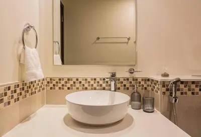 a bathroom with a large white bowl sink on a counter at AXINITE - Brand New! Warm Cozy 1 Bed HIGH FLOOR Downtown Dubai CANAL VIEW in Dubai