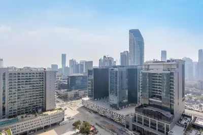 an aerial view of a city with tall buildings at Reva Residences - One Bedroom Apartment by the S Holiday Homes in Dubai
