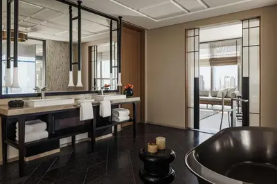 a bathroom with a large mirror and a tub at One&Only One Za'abeel in Dubai