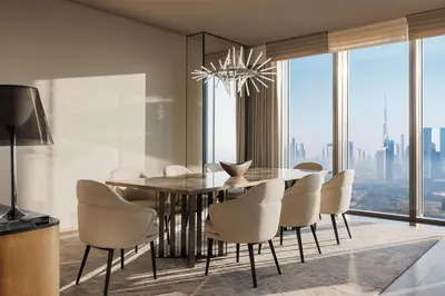 a dining room with a table and chairs and a chandelier at One&Only One Za'abeel in Dubai