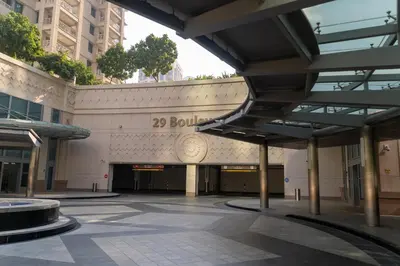 a building with a sign on the side of it at Bellavista - High Floor - 1BR 29 Boulevard - Burj Khalifa & Fountain View in Dubai