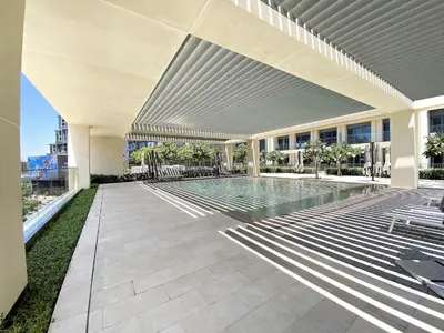 a swimming pool in the middle of a building at Silkhaus sophisticated 1BDR in Downtown premium tower in Dubai