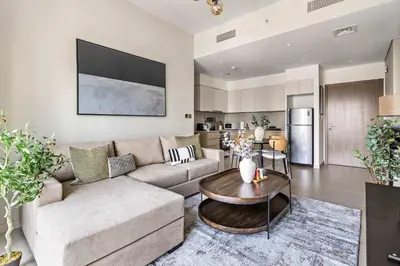 a living room with a couch and a table at Silkhaus sophisticated 1BDR in Downtown premium tower in Dubai