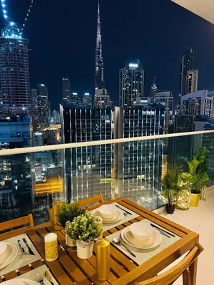 a table on a balcony with a view of a city at In the heart of Business Bay - Bills included in Dubai
