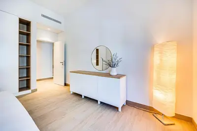 a dressing room with a mirror and a dresser at Amazing 1BD sea view apartment in Port de La Mer in Dubai