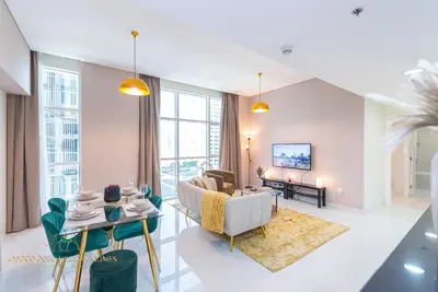 a living room with a couch and a table at Marco Polo - Enjoy comfort and class near Burj Khalifa in Dubai