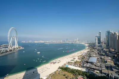 an aerial view of a beach with a ferris wheel at Beachfront 1 Bed with Full JBR View in Dubai