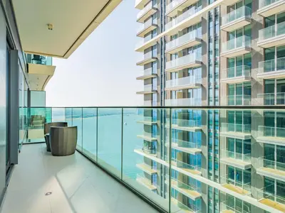 an office building balcony with a view of the water at Exceptional 2BR-Private Beach Access-Palm Jumeirah in Dubai