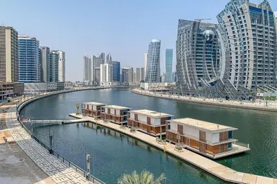 a river in a city with tall buildings at Frank Porter - 15 Northside Tower 2A in Dubai