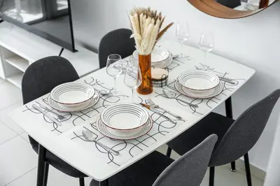 a white table with plates and utensils on it at 1Br Suit with Full Canal View - Down Town in Dubai