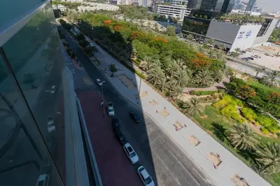 an aerial view of a city street with cars on the road at Studio in JVC - Heart of Dubaï - Bloom Height in Dubai
