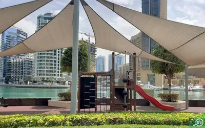 a playground with a slide in a city at Scenic 1BR at Bay Central 1 Dubai Marina by Deluxe Holiday Homes in Dubai