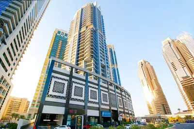 a tall building in a city with tall buildings at RH- City Living in Style, Large 1 BR with open Terrace, Dubai Marina in Dubai
