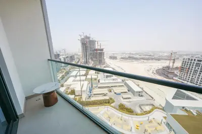 a view of a city from a window in a building at Bright Apartment With Panoramic CityScape Views in Dubai