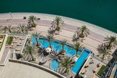 an overhead view of a resort with palm trees and a pool at Frank Porter - Bonaire Tower in Dubai