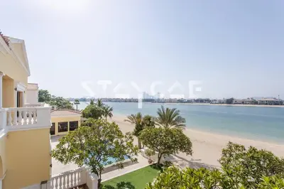 an apartment with a view of the beach at Staycae Palm Jumeirah Villa in Dubai
