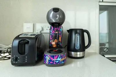 a coffee maker and a toaster on a counter at 2bdr Emaar The Grand - Sea View - Creek Harboor in Dubai