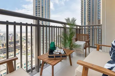 a balcony with benches and a view of a city at Frank Porter - Creekside 18 in Dubai