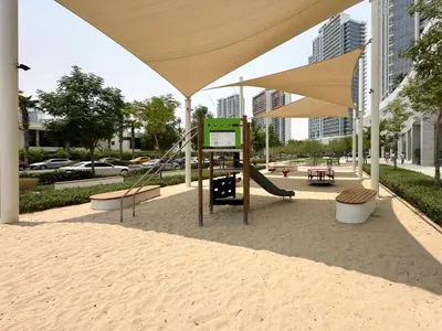 a playground with a slide and a swing at Trophy - Urban Escape Suite in Dubai