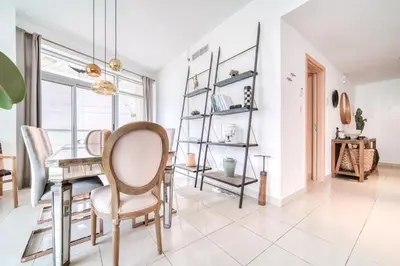 a dining room with a table and chairs at Fairfield Tower, Park Island, Dubai Marina - Mint Stay in Dubai