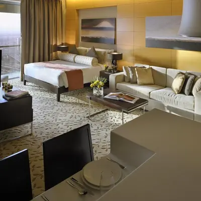 a hotel room with a bed and a living room at Emaar Dubai Mall Residences - formerly Address Dubai Mall Residences - Burj Khalifa View in Dubai