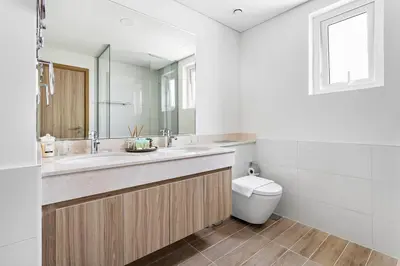 a bathroom with a sink and a toilet at Luxurious 3BR Villa Amaranta in Dubai