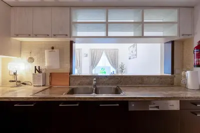 a kitchen with a sink and a window at INA Homes-BLVD Central 2BHK Apartment near Burj Khalifa in Dubai