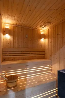a sauna with a tub with a bowl in it at Sleek 1 Bedroom with Views of Dubai Marina in Dubai