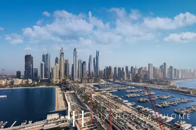 an aerial view of a large city with a harbor at LUX The Ultimate Palm Sea Skyline Penthouse in Dubai
