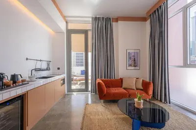 a living room with a couch and a table at Shada Hotel Dubai - فندق شدا دبي in Dubai