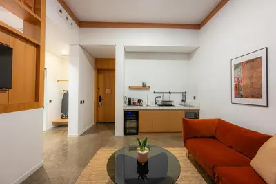 a living room with a couch and a table at Shada Hotel Dubai - فندق شدا دبي in Dubai