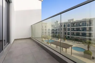 an empty balcony with a view of a building at Silkhaus aesthetic studio in Art Gardens with gym & pool access in Dubai