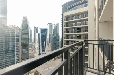 a balcony with a view of a city at White Sage - DAMAC Zada Tower in Dubai