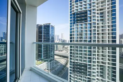 a view of a city from a window in a building at White Sage - Fancy Studio With Mesmerizing Canal Views in Dubai