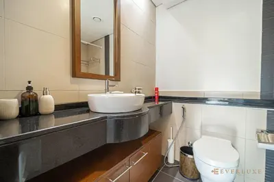 a bathroom with a sink and a toilet at Everluxe Lovely Studio Apt In Business Bay in Dubai